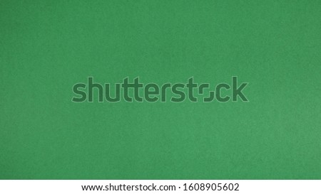 green paper for background.it is empty space and no people.