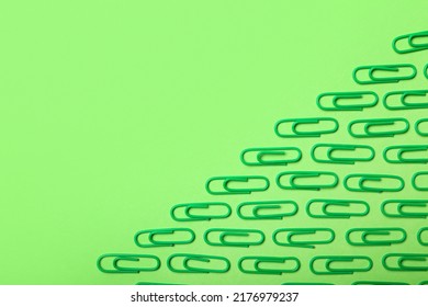 Green Paper Clips On Color Background