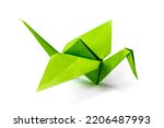 Green paper crane origami isolated on a blank white background.