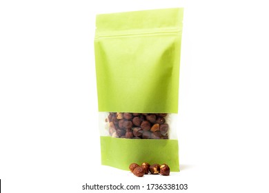 Green Paper Doy Pack Standup Pouch Filled With Hazelnuts With Window And Zipper Front View On White Background