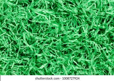 Green Paper Easter Grass Background From Above. Colored Crinkle Grass. Gift Basket Shred And Filler. Decoration.