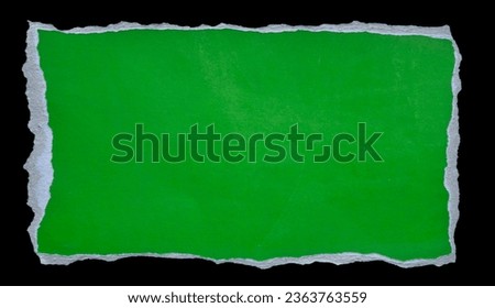green paper framed text torn in the shape of a rectangle. Blank old paper template with black background and clipping path.