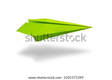 Green paper plane origami isolated on a blank white background