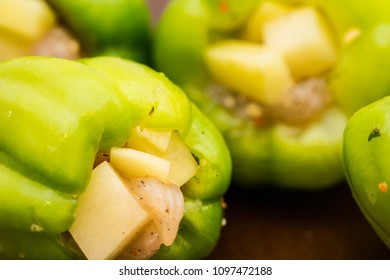 Green paprica filled by potatos and chicken breast pieces 