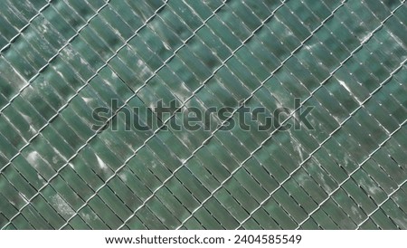 Green patterns. Diagonal wires for the fence.