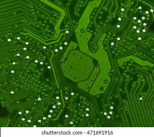 green pcb board with chip socket microchip motherboard abstract background