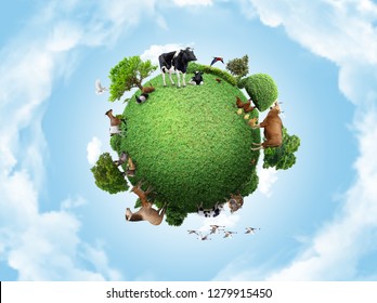 Green peace earth, miniature planet, globe concept showing a green, peaceful and animals poultry life 