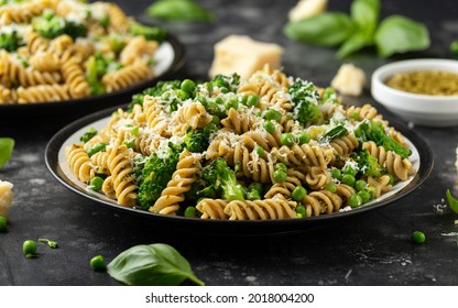 Green peas, broccoli pasta with pesto sauce and parmesan cheese. healthy food.