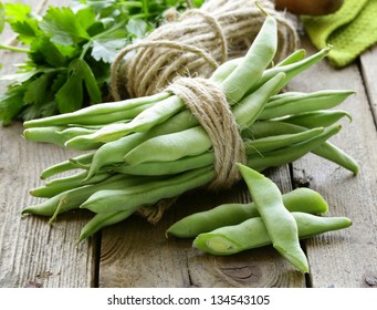green peas on a wooden table, rustic style
