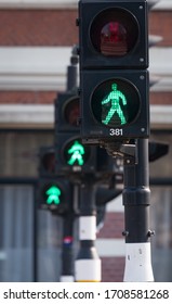 Green pedestrain crossing light in Amsterdam, Netherlands