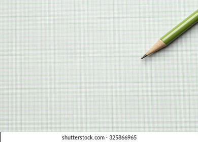 Green Pencil On Graph Paper Background