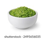 Green pesto sauce in ceramic cup isolated on white