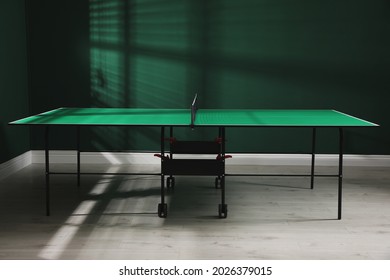 Green Ping Pong Table With Net In Room