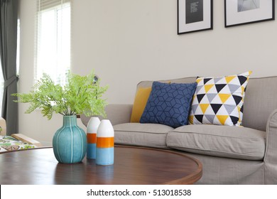 Green Plants In Ceramic Vase In Living Room On Table