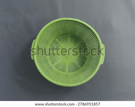 Green plastic colander, kitchen strainer bowl, food washing basket, colander for vegetable, kitchen essential tool, photo object, design material, graphic resource, raw picture, editable image, cut out, removable background, unedited and natural look 