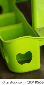 A Green Plastic Cup Drink Holder