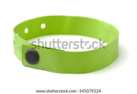 Green plastic ID wristband for hotel or hospital isolated on white