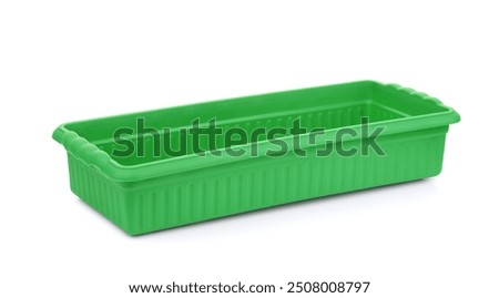 Green plastic rectangular planter flower pot  isolated on white