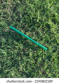 A Green Plastic Straws On The Grass