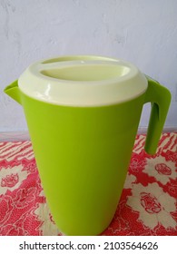 Green Plastic Water Jug ​​on The Table