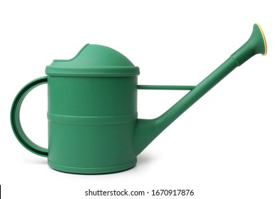 Green plastic watering can on white background