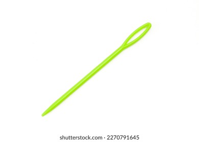Green plastic yarn needle isolated on white background. Large-Eye  Weaving Sewing Knitting needle