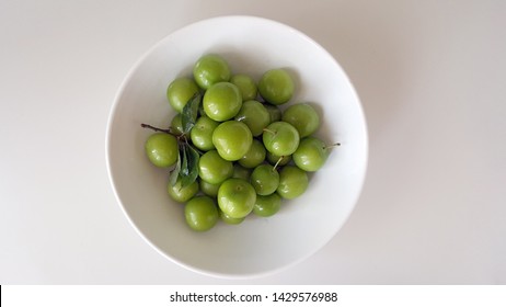 Green Plum Fruit on White Plate