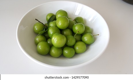 Green Plum Fruit on White Plate