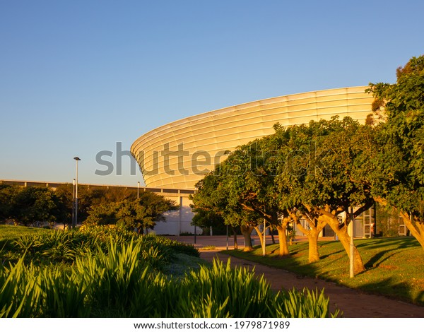 Green\
Point, Cape Town, South Africa - 17-05-2021\
\
Cape Town Stadium on\
a lovely, warm afternoon. Blue sky in\
background.