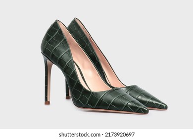 Green pointy toe women's shoes with high heels isolated on white background. Female classic stiletto heels in crocodile skin leather. Mock up, template - Powered by Shutterstock