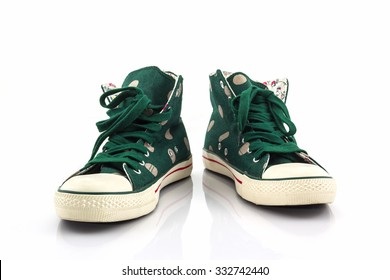 Green Polka Dot Canvas Shoe On White Background.