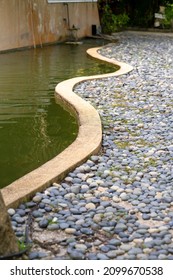 Green Pond Next To The Reflexology Pebble Path