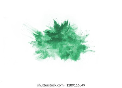 Green powder explosion on white background. Colored cloud. Colorful dust explode. Paint Holi.