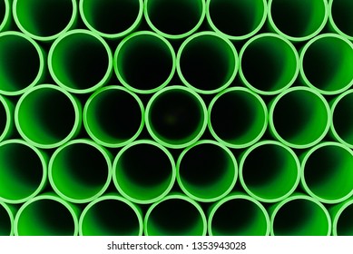 Green PPR plastic water pipe. Industrial background