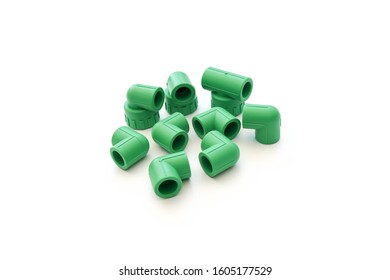 Green PPR water pipe fitting,  connectors on white background.  