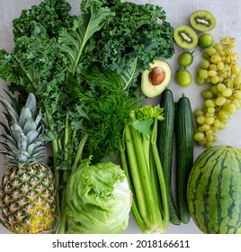 Green produce haul. Veggies and fruits. Kale, celery, pineapple, grapes, watermelon.
