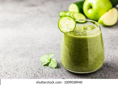 Green Protein Smoothie In A Glass On Concrete Background. Selective Focus, Copy Space.