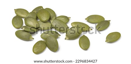 Green pumpkin seeds isolated on white background. Scattered seed. Package design element with clipping path