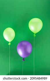 Green And Purple Balloon An Green Background