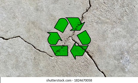 Green Recycle Icon On A Cracked Cement Wall Background, Reuse Waste Construction Materials, Be Environment Responsible, Sustainable Development, Creative Environment Friendly Symbol Wallpaper