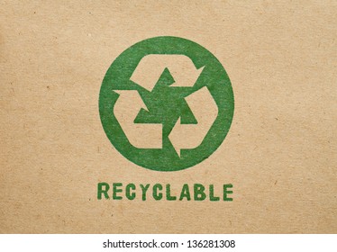 Green recycle symbol on cardboard - Shutterstock ID 136281308