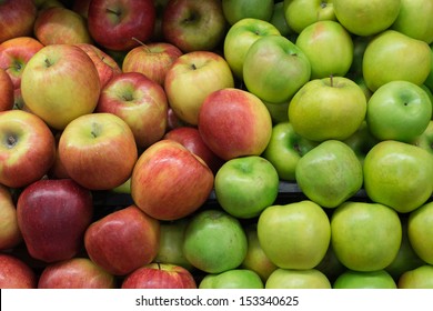 Green And Red Apples On Shelf 