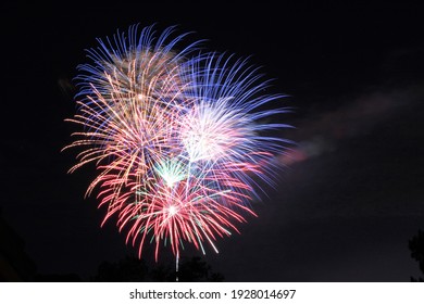 Green Red Blue Yellow Orange Fireworks Shot With A Long Exposure On Independence Day Anniversary With Dark Black Sky Background