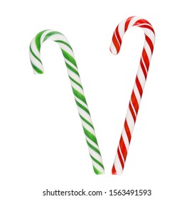 Green and red Christmas candy canes isolated on white background