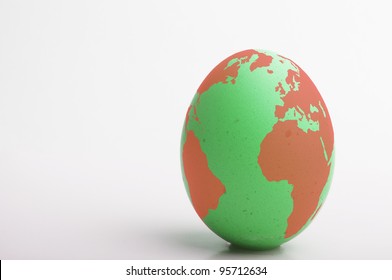 Green and red egg with image of globe, United Kingdom, Europe and Africa as main focus