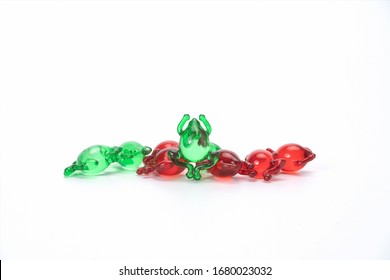 Green And Red Frog Shaped Pills. This Is The Development Trend Of Pediatric Medical Industry In The Future. Lovely Shaped Capsules Can Make Children Not Afraid To Take Medicine.