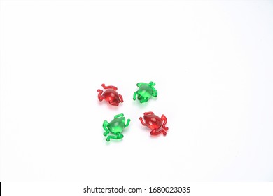 Green And Red Frog Shaped Pills. This Is The Development Trend Of Pediatric Medical Industry In The Future. Lovely Shaped Capsules Can Make Children Not Afraid To Take Medicine.