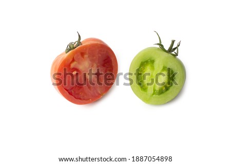 Green and red tomatoes. Cut and complete. Shooting isolated on white background. studio shoot