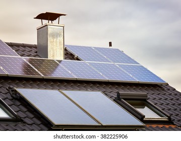 Green Renewable Energy. Photovoltaic Panels on the Roof. A completely solar energy powered house. - Shutterstock ID 382225906