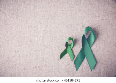 Green Ribbons copy space toning background, cancer awareness, Liver, kidney cancer awareness,Glaucoma Awareness - Shutterstock ID 461584291